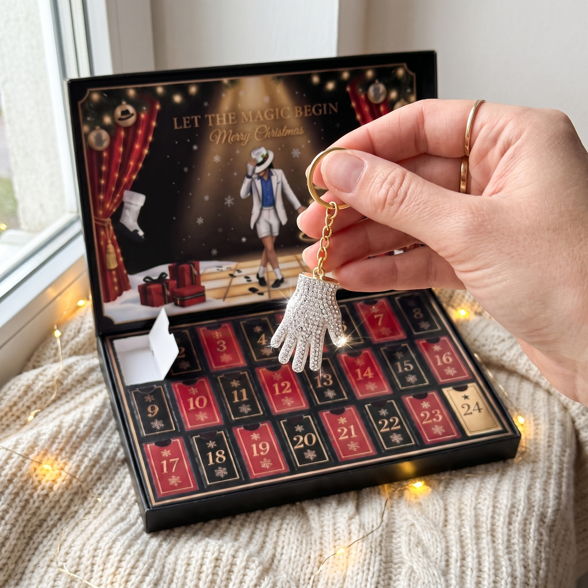 The Crystal Glove keychain held in front of the open calendar